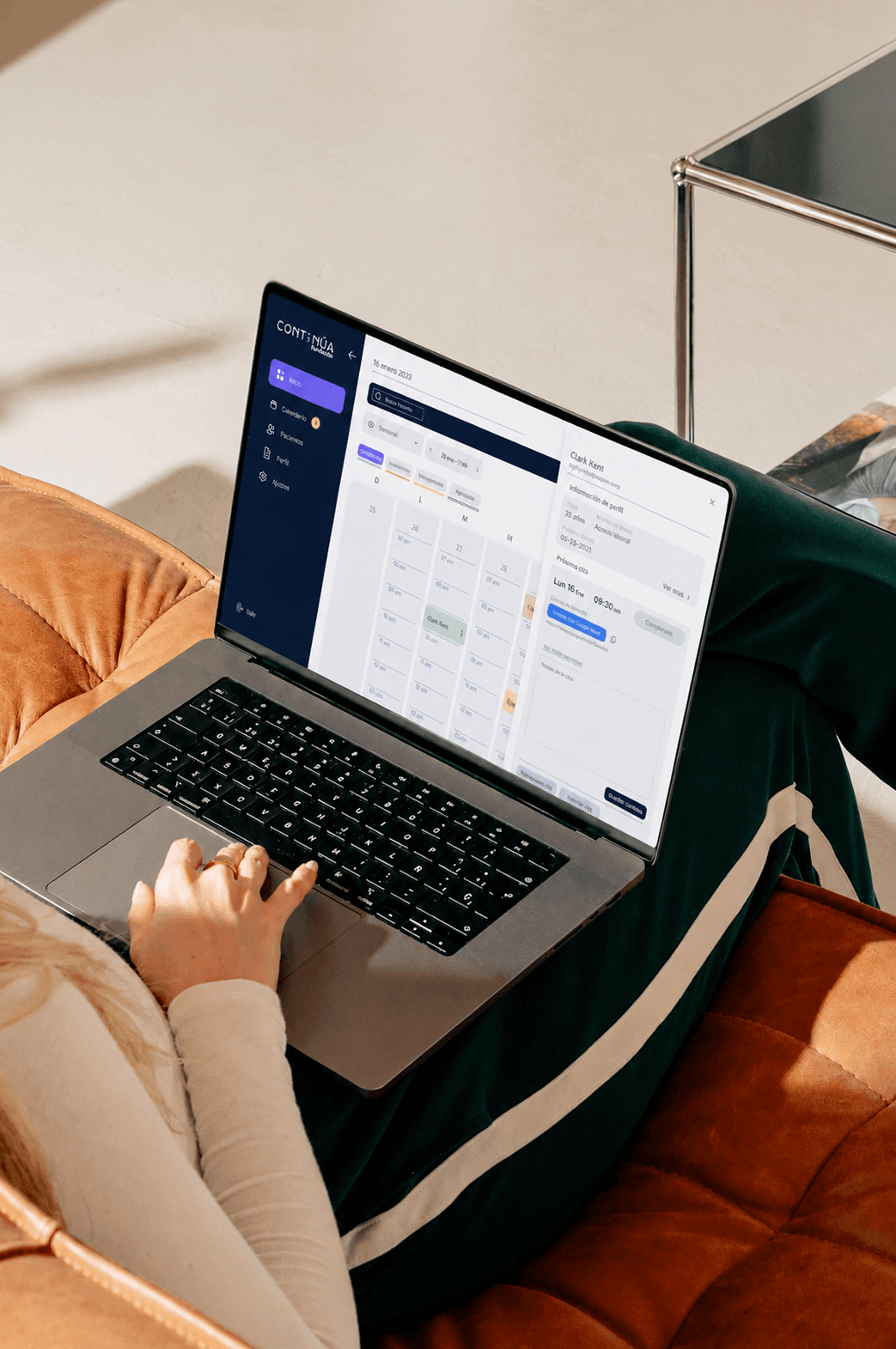 Psychologist using the continualatam calendar and patient management workspace on a laptop